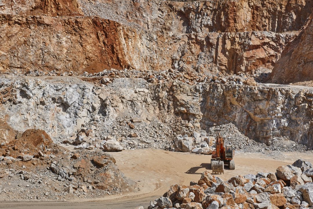 Heavy excavator on a quarry. Excavation machinery. Earthmover